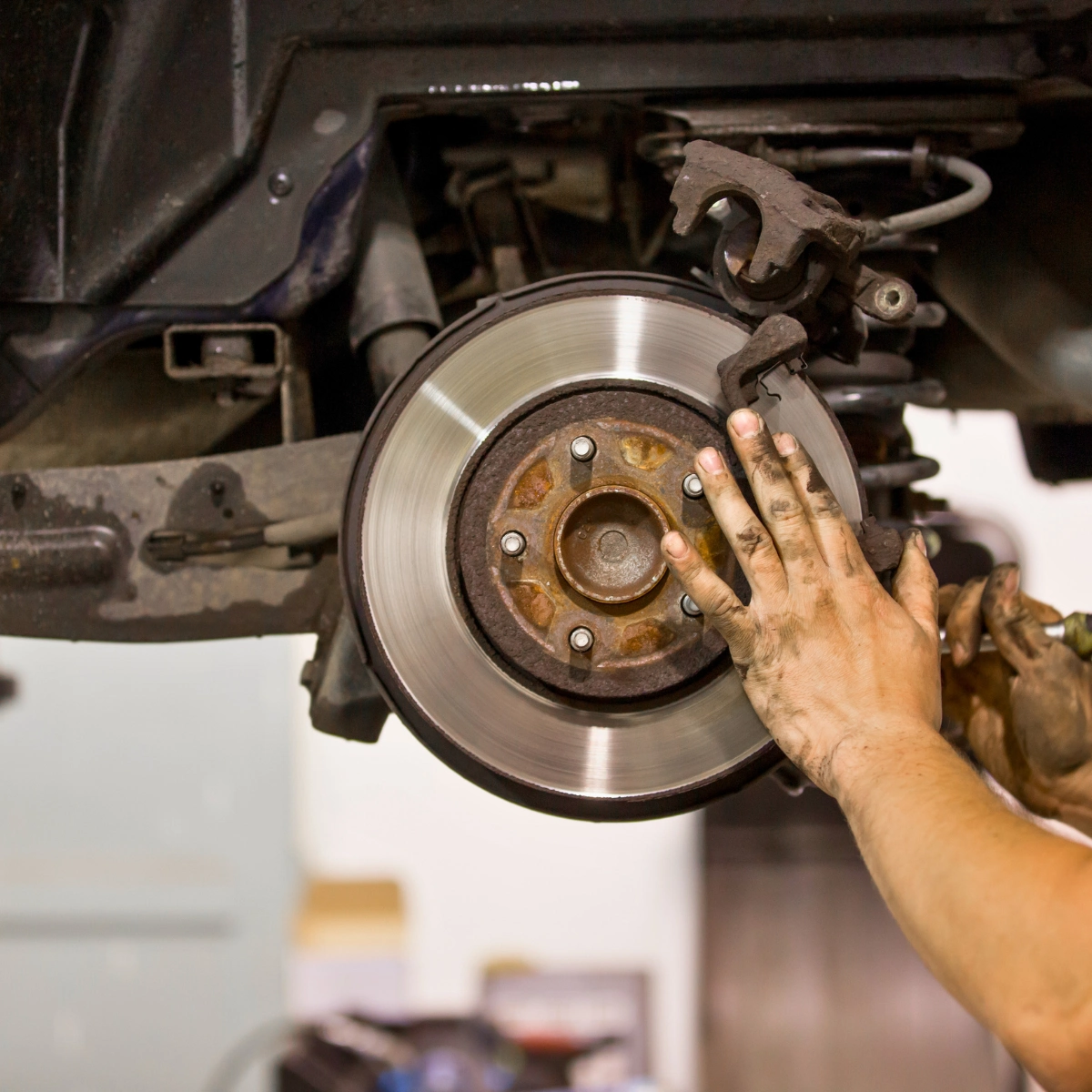 Auto repair shop performing brake diagnostics