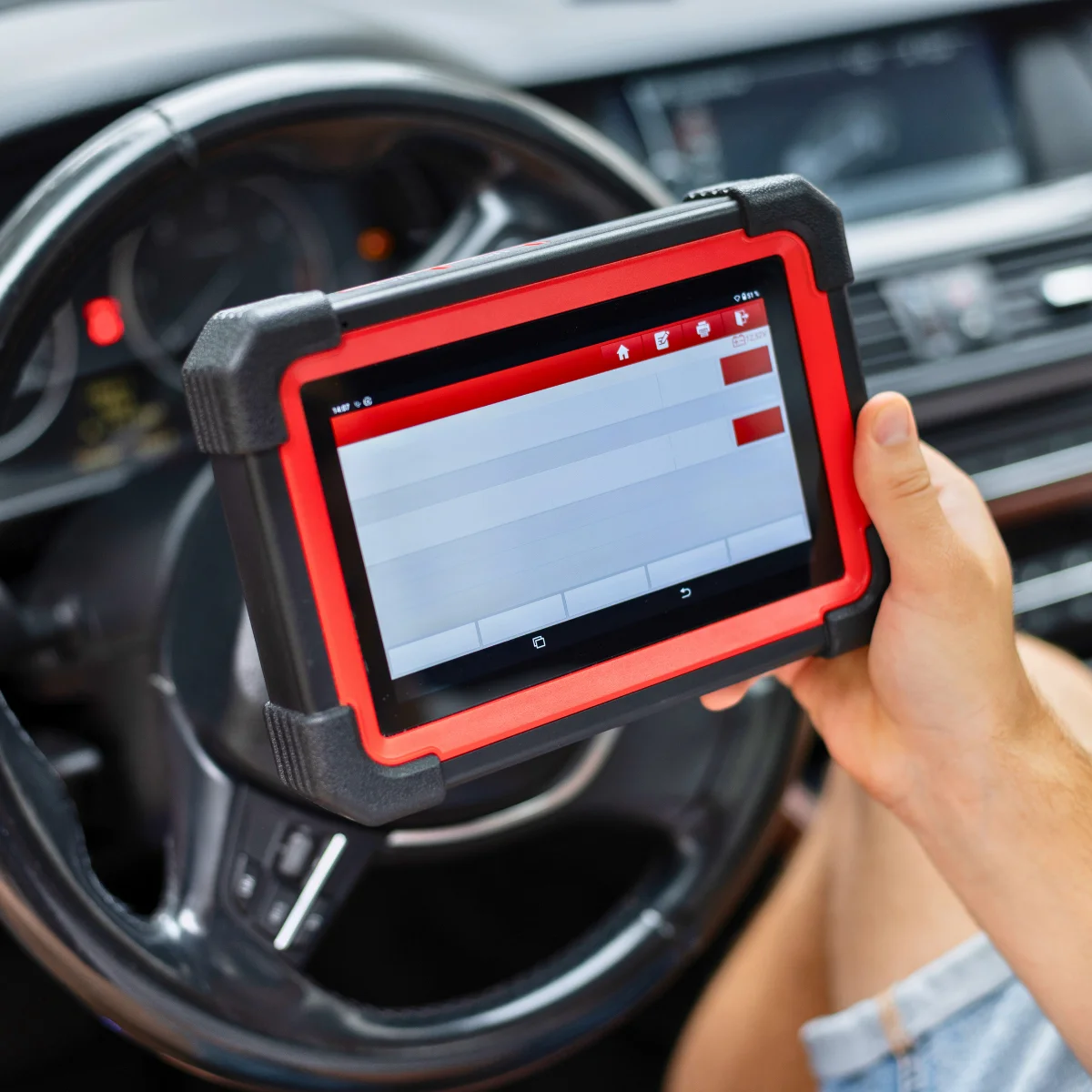 Diagnostic scanner connected to vehicle