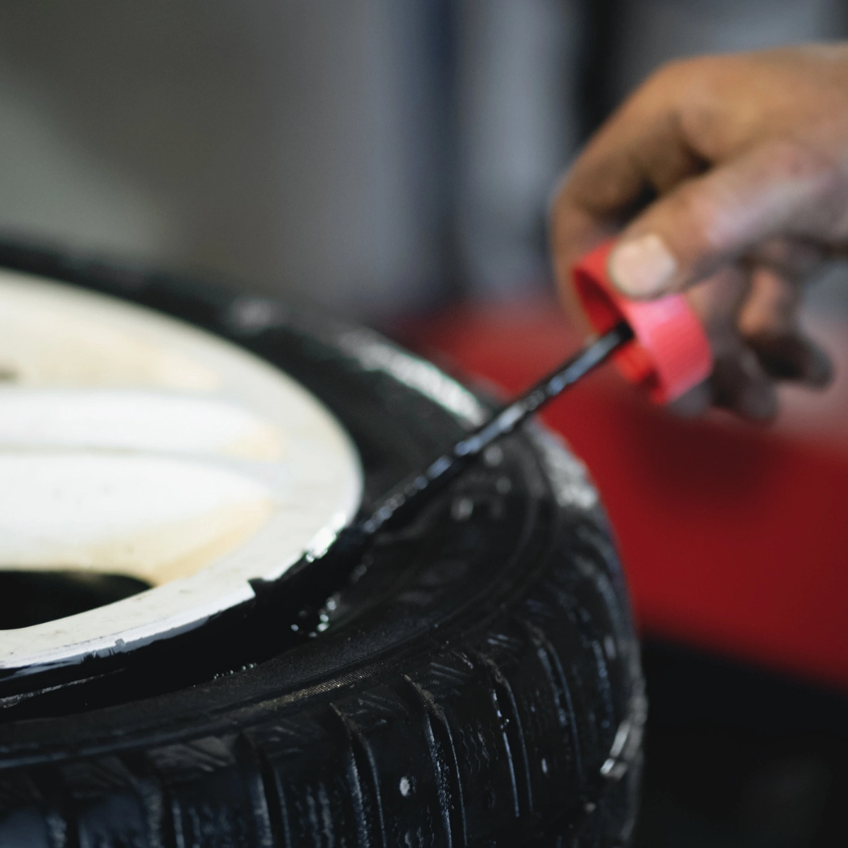 Technician inspecting a tire